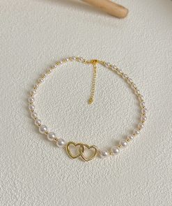 2025 French Style High-End Hollow Heart Pearl Choker Necklace - Short, Niche Design for Elegant Fashion