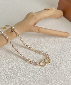 2025 French Style High-End Hollow Heart Pearl Choker Necklace - Short, Niche Design for Elegant Fashion