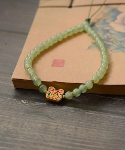 Handmade Beaded Glass Phone Lanyard with Gold Beast Design - Short Anti-Lost Wrist Strap Accessory for Mobile Phones