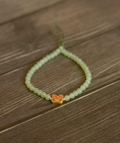 Handmade Beaded Glass Phone Lanyard with Gold Beast Design - Short Anti-Lost Wrist Strap Accessory for Mobile Phones