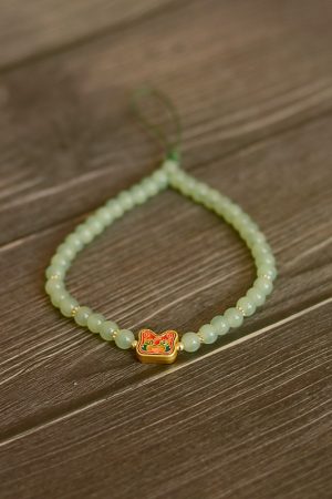 Handmade Beaded Glass Phone Lanyard with Gold Beast Design - Short Anti-Lost Wrist Strap Accessory for Mobile Phones