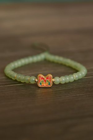 Handmade Beaded Glass Phone Lanyard with Gold Beast Design - Short Anti-Lost Wrist Strap Accessory for Mobile Phones