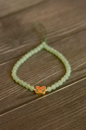 Handmade Beaded Glass Phone Lanyard with Gold Beast Design - Short Anti-Lost Wrist Strap Accessory for Mobile Phones