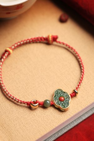 Handmade Chinese Style Natural Jadeite Ruyi Bracelet with Pure Silver and Red Rope â€“ Retro Gift for Women