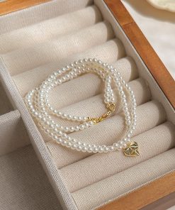 High-End Double-Layer Pearl Necklace with Heart Pendant - Exquisite French Style Clavicle Chain for Elegant Fashion
