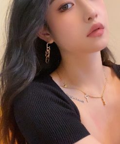 High-End Geometric Oval Linked Black and White Enamel Drip Glaze Diamond-Inlaid Gold-Plated Earrings for Elegant Style