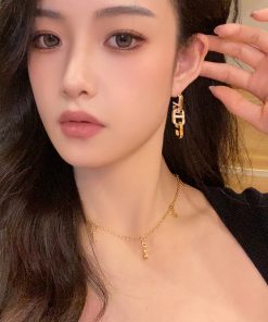 High-End Geometric Oval Linked Black and White Enamel Drip Glaze Diamond-Inlaid Gold-Plated Earrings for Elegant Style