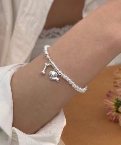 Korean and Japanese Style Lightweight Luxury Dog Bone Pendant Bracelet for Women â€“ High-Quality Niche Design
