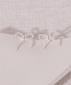 Minimalist Floating Bowknot Stud Earrings in S925 Silver - Youthful High-End Twisted Design for Elegant Everyday Wear