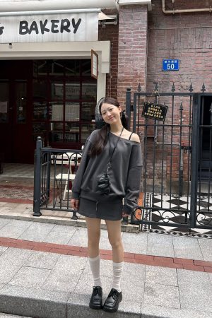 Off-Shoulder Sweatshirt and Deep Gray Half-Skirt Casual Outfit - Trendy American Style with Long Pants for Effortless Chic Look