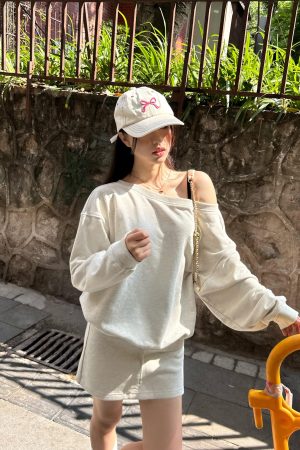 Off-Shoulder Sweatshirt and Deep Gray Half-Skirt Casual Outfit - Trendy American Style with Long Pants for Effortless Chic Look