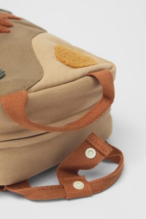 red knit sweater style, Urban Winter Outfits - Dinosaur Mini Backpack
