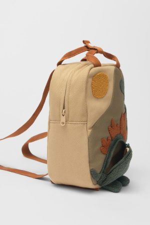 red knit sweater style, Urban Winter Outfits - Dinosaur Mini Backpack