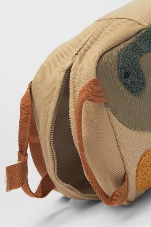 red knit sweater style, Urban Winter Outfits - Dinosaur Mini Backpack
