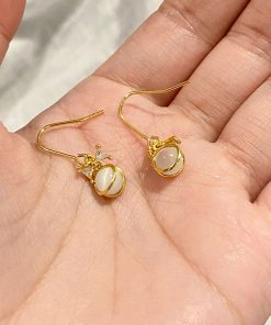 Trendy Cool-Toned Cat's Eye Stone Bowknot Stud Earrings - 2025 High-End Fashionable Niche Design for a Chic Look