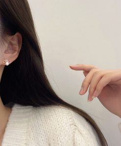 Trendy Hollowed-Out Bow Imitation Pearl Stud Earrings for Women - 2025 High-End Light Luxury Ear Accessories