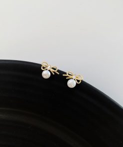 Trendy Hollowed-Out Bow Imitation Pearl Stud Earrings for Women - 2025 High-End Light Luxury Ear Accessories