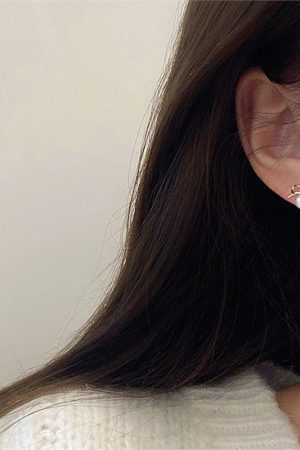 Trendy Hollowed-Out Bow Imitation Pearl Stud Earrings for Women - 2025 High-End Light Luxury Ear Accessories